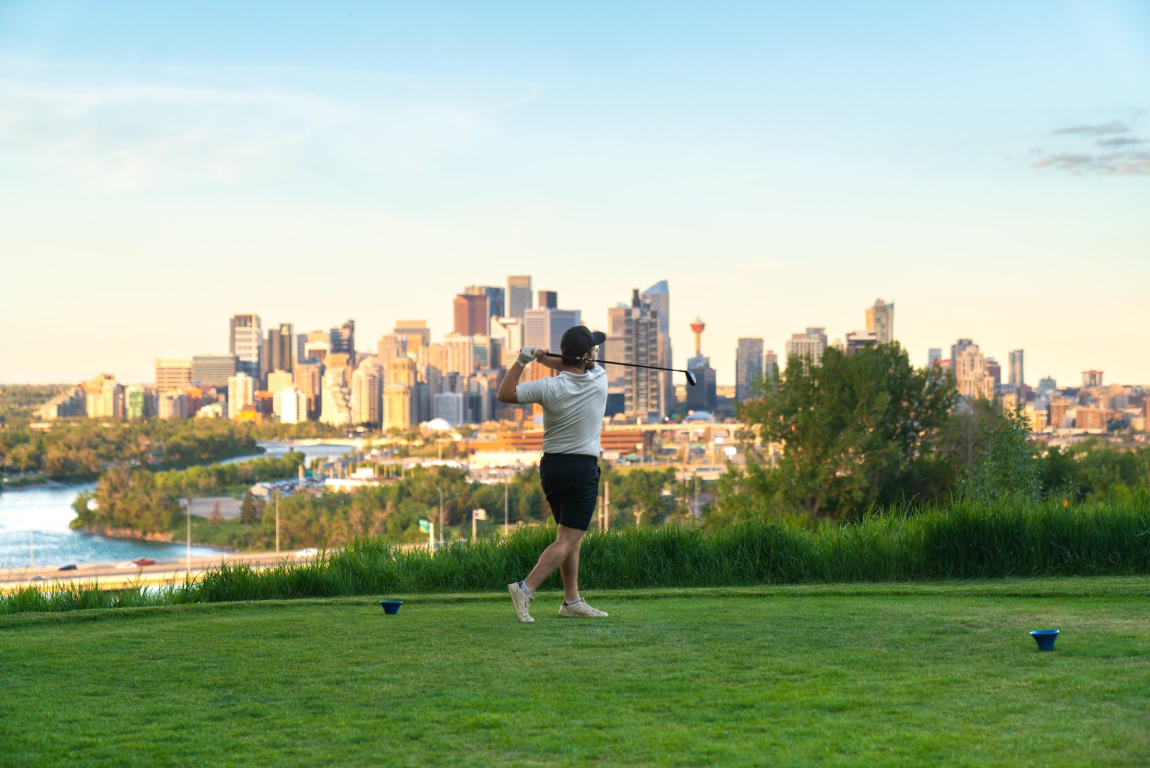 Golfer swinging at the Shaganappi Golf Course
