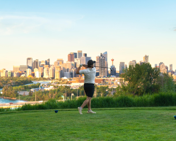 Golfer swinging at the Shaganappi Golf Course