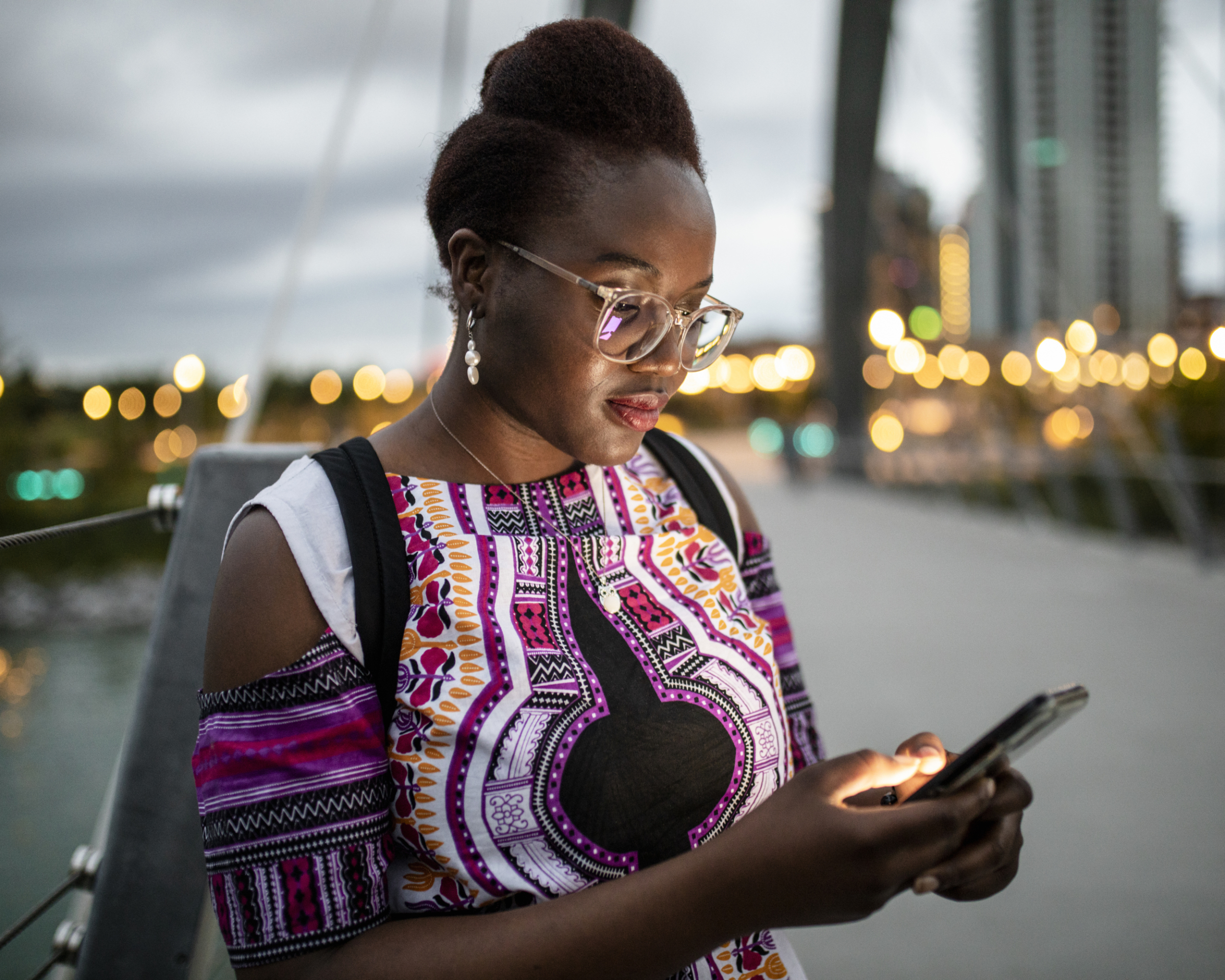 Woman viewing phone by George C. Kind Bridge