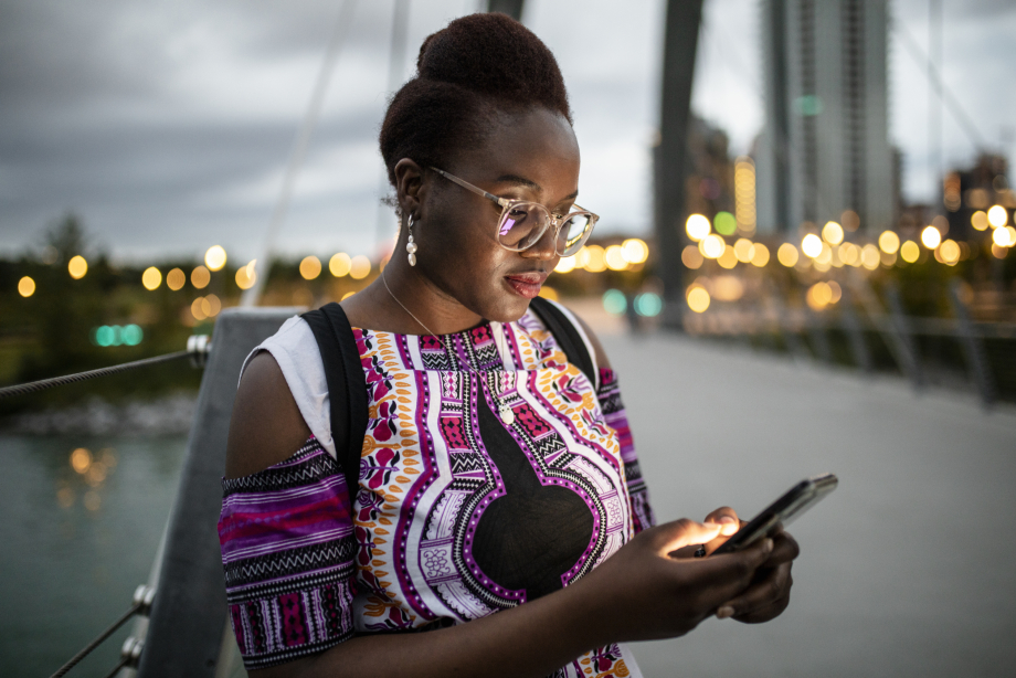 Woman viewing phone by George C. Kind Bridge