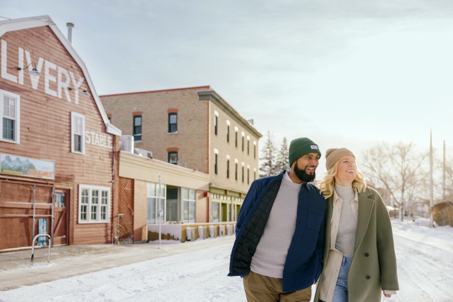 A couple walks past the Livery Stable in Inglewood on a wintery day.