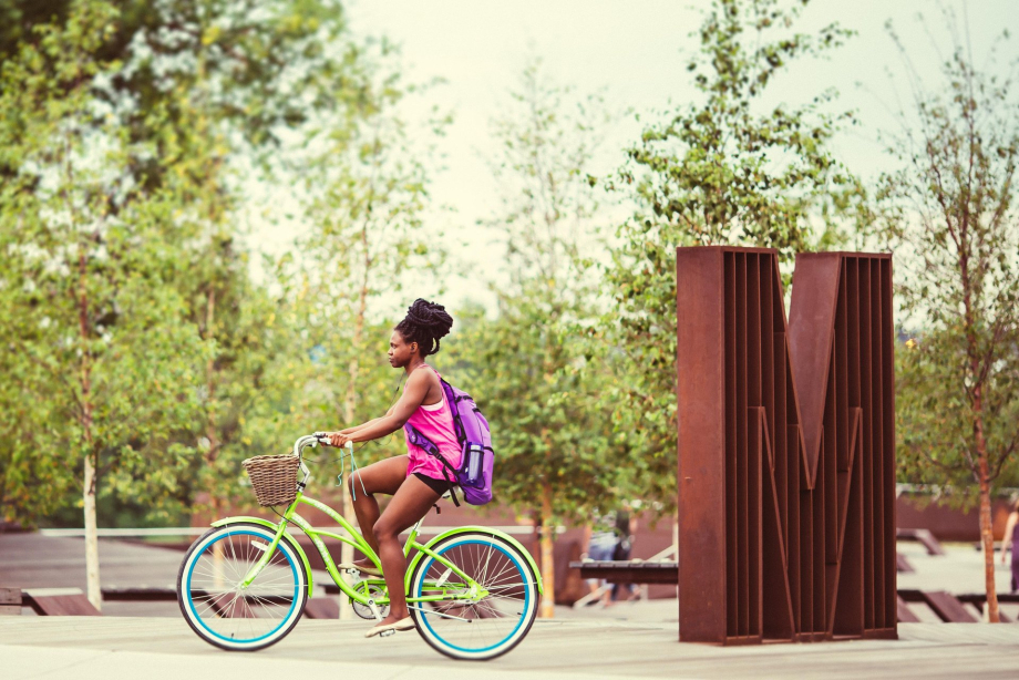 Biking along Poppy Plaza on Memorial Drive near Kensington Village