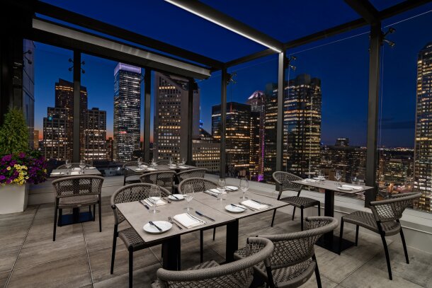 Night time view of rooftop patio of The Wilde at The Dorian Hotel in Calgary