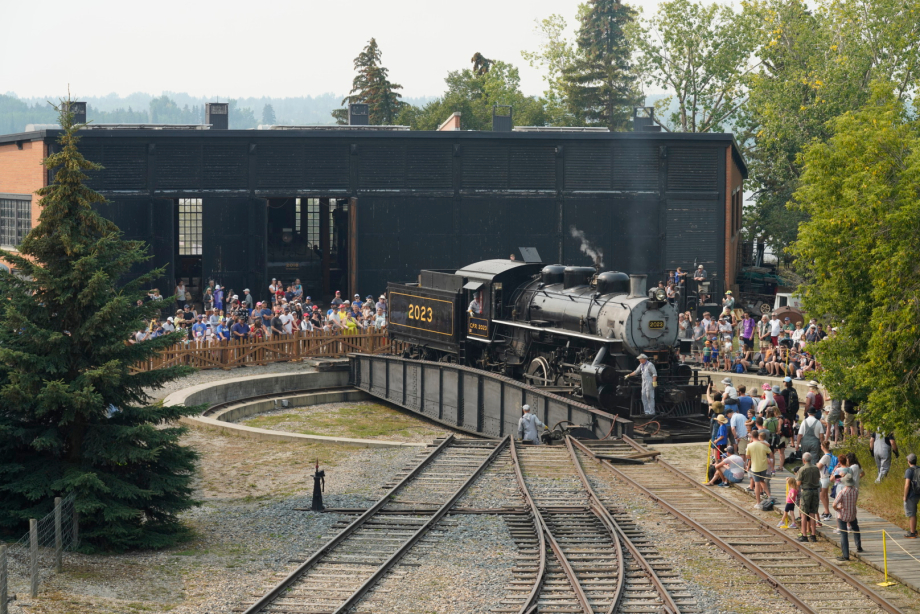 Railway turntable at Heritage Park as people gathered watch