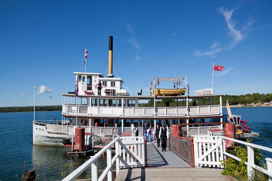 A steamboat, the S.S. Moyie, docked at the end of a pier at Heritage Park in Calgary