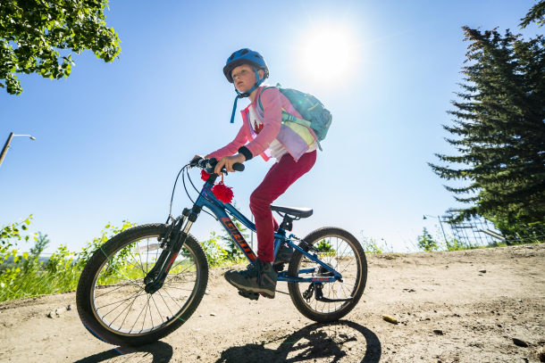 Young girl mountain biking