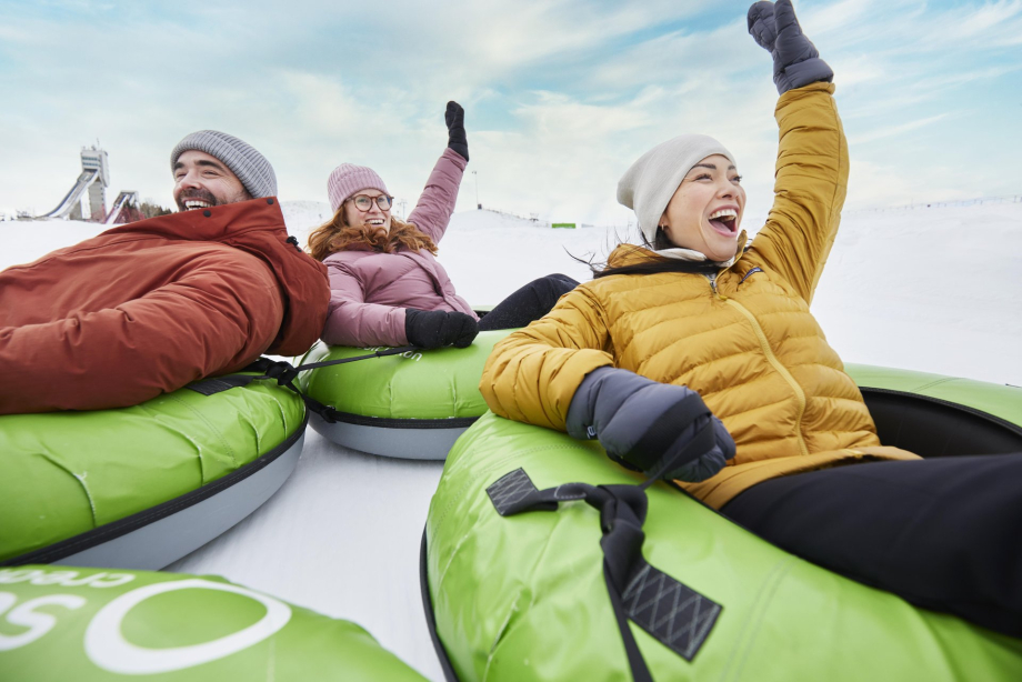 3 friends Snow Tubing at WinSport