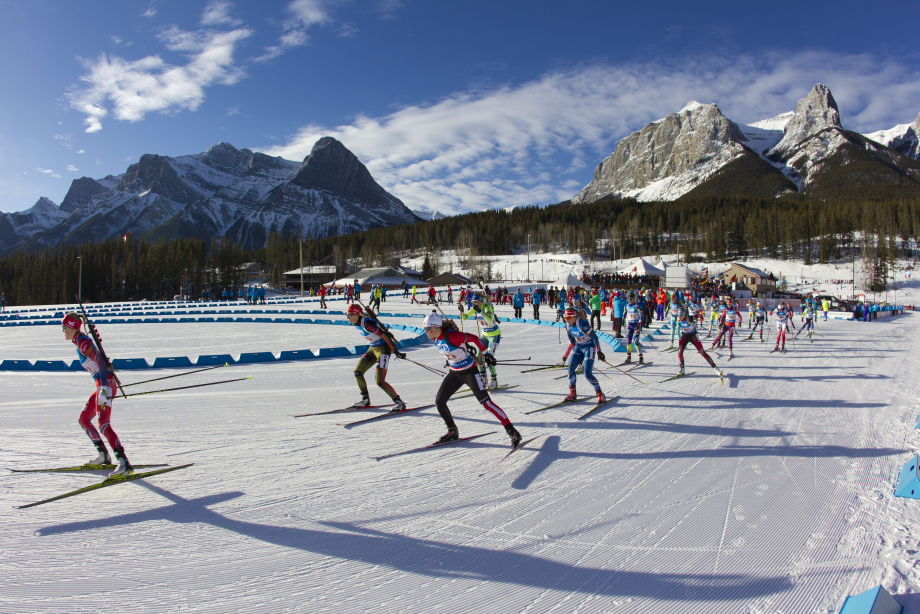 Group of people skiing down the Canmore Nordic slope
