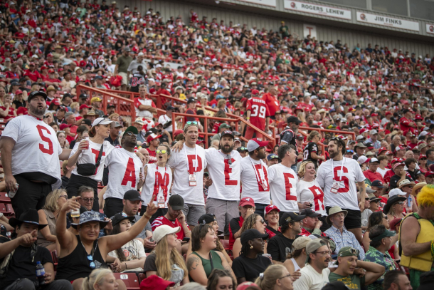 Stamps fans cheering at the stadium
