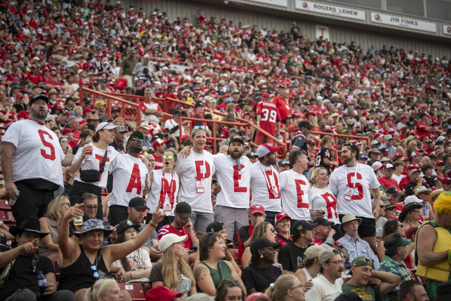 Stamps fans cheering at the stadium
