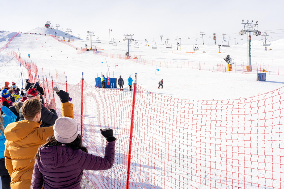 Spectators cheering on a ski competition