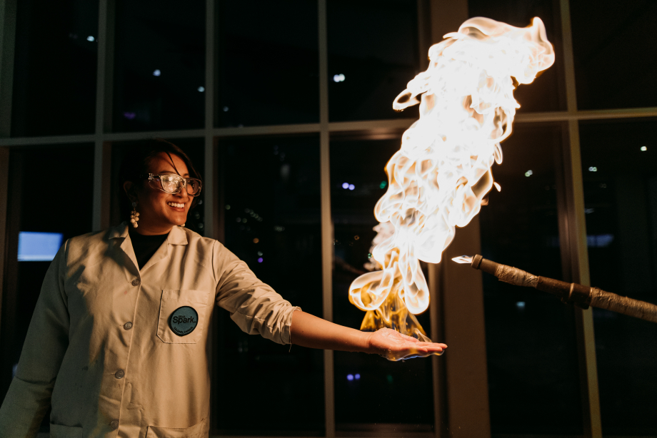 Woman playing with fire at TELUS Spark