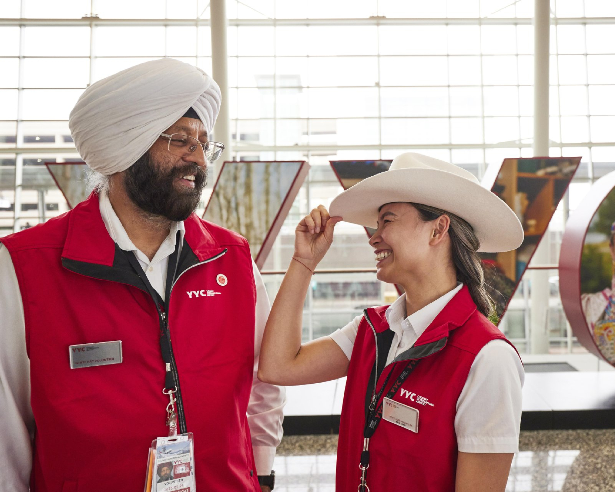 White Hat greeters wait to welcome visitors to Calgary