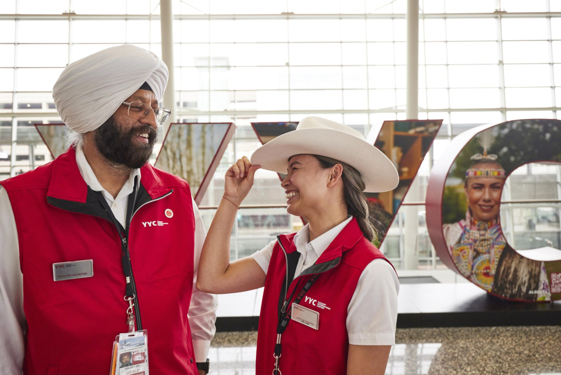 White Hat greeters wait to welcome visitors to Calgary