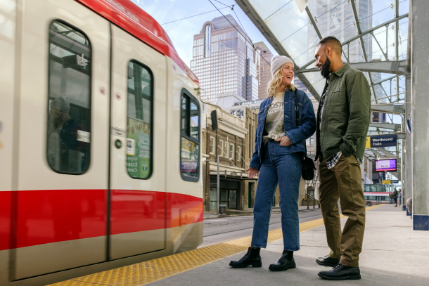 Couple on the C-Train platform in downtown Calgary