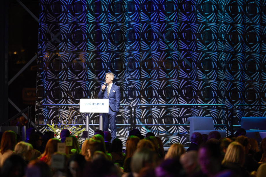 Dave Kelly speaking during the YWhisper Gala 2023 at the Calgary TELUS Convention Centre