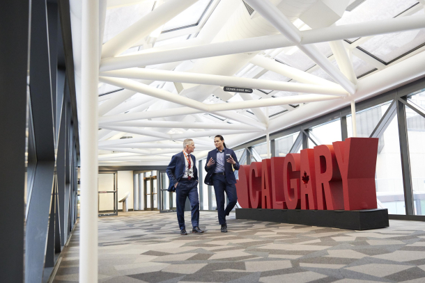 two men walking in the Calgary TELUS Convention Centre